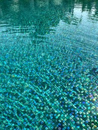 Clear rippled water in swimming pool outdoors