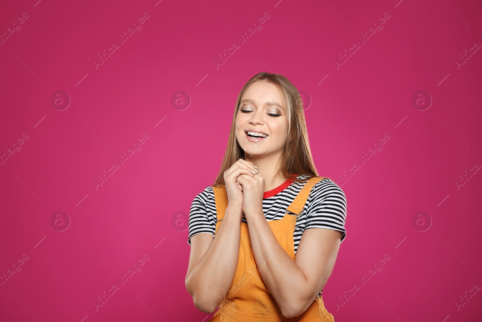 Photo of Portrait of beautiful young woman on colorful background