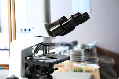 Photo of Modern microscope in laboratory, closeup. Phytopathological analysis
