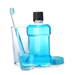 Photo of Mouthwash and other items for teeth care on white background