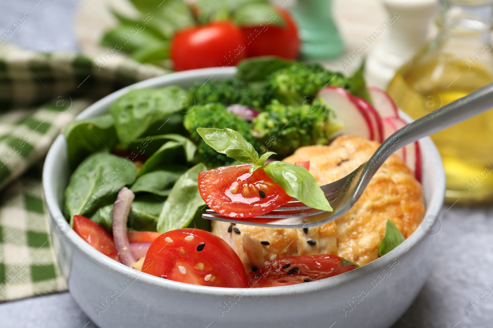 Photo of Healthy meal. Eating tasty vegetables and chicken at table, closeup