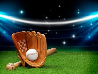 Image of Baseball bat, glove and ball on grass at stadium. Space for text