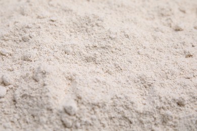 Photo of Pile of oat flour as background, closeup
