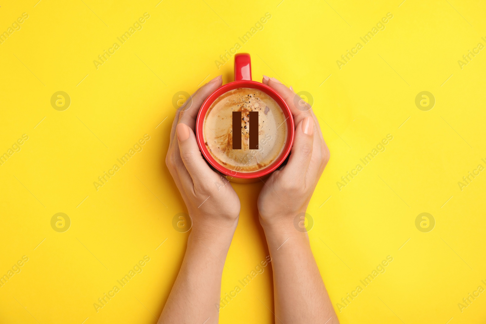 Image of Coffee Break. Woman with cup of americano on yellow background, top view