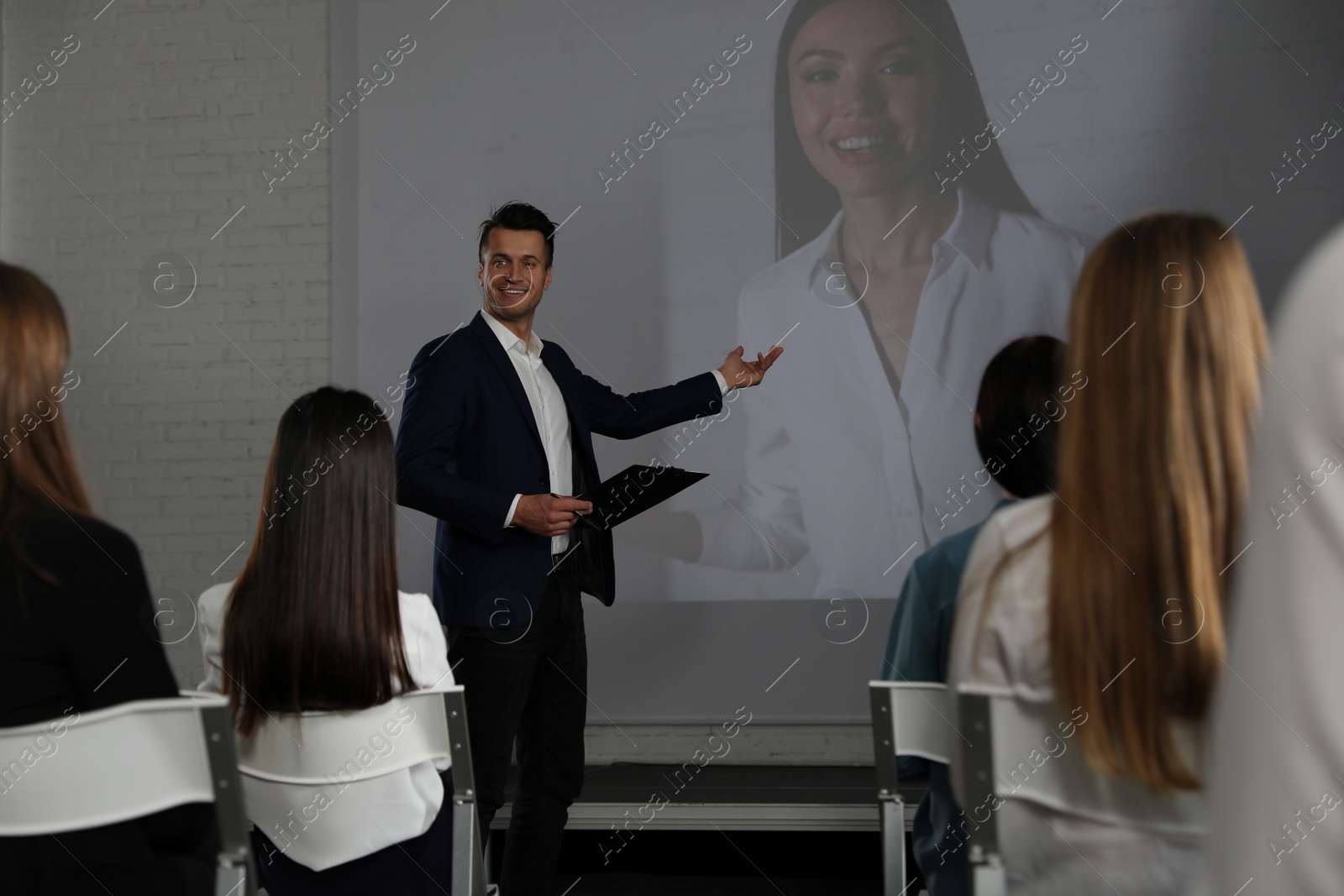 Photo of Video conference with female business trainer in office