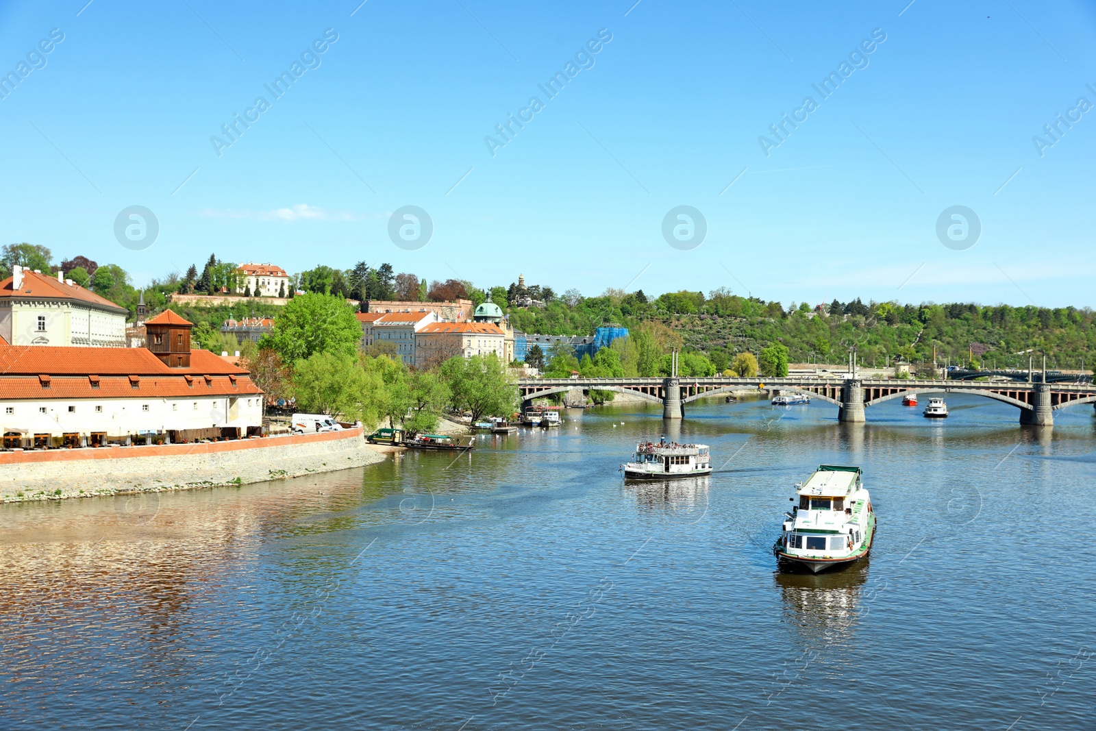 Photo of PRAGUE, CZECH REPUBLIC - APRIL 25, 2019: Cityscape with tourist attractions, Manes Bridge and Vltava river