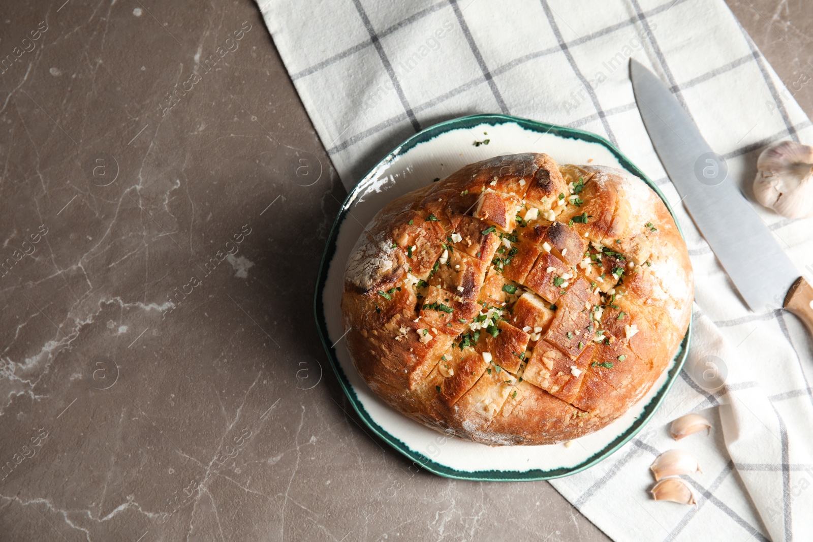 Photo of Flat lay composition with tasty garlic bread and space for text on table