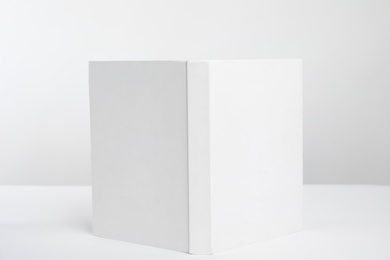 Photo of Book with blank cover on white background