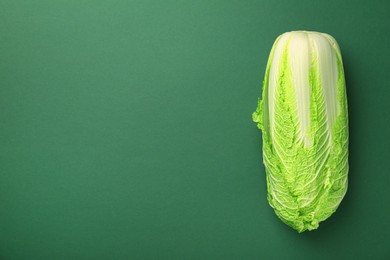 Fresh ripe Chinese cabbage on green background, top view. Space for text