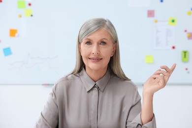 Photo of Portrait of professor giving lecture in classroom