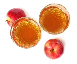 Photo of Glasses of juice and fresh apples on white background, top view