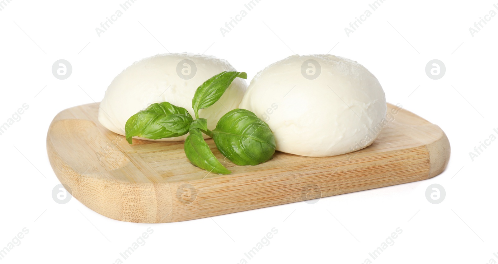 Photo of Wooden board with delicious mozzarella cheese balls and basil on white background
