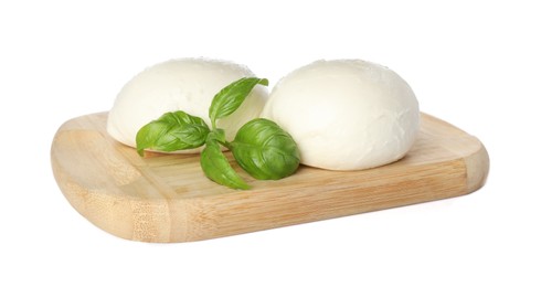 Photo of Wooden board with delicious mozzarella cheese balls and basil on white background