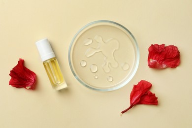 Photo of Petri dish with cosmetic product and flower petals on beige background, flat lay