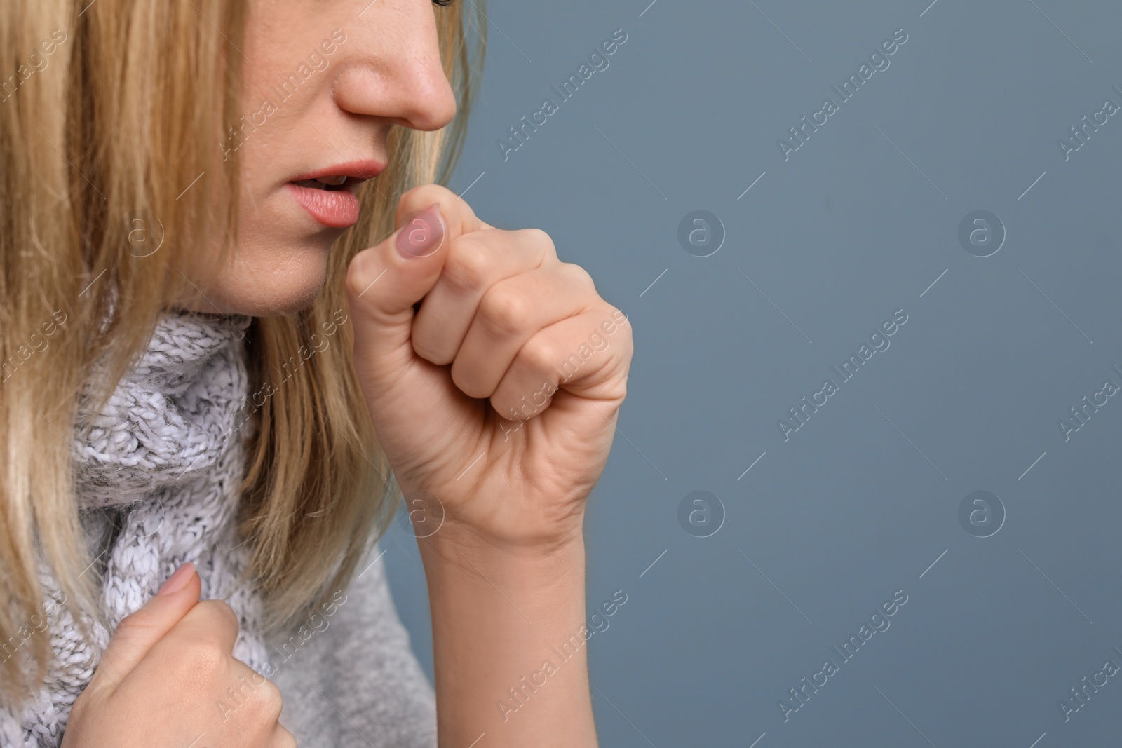 Photo of Young woman coughing on color background