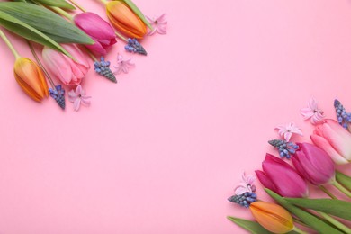 Beautiful different flowers on pink background, flat lay. Space for text