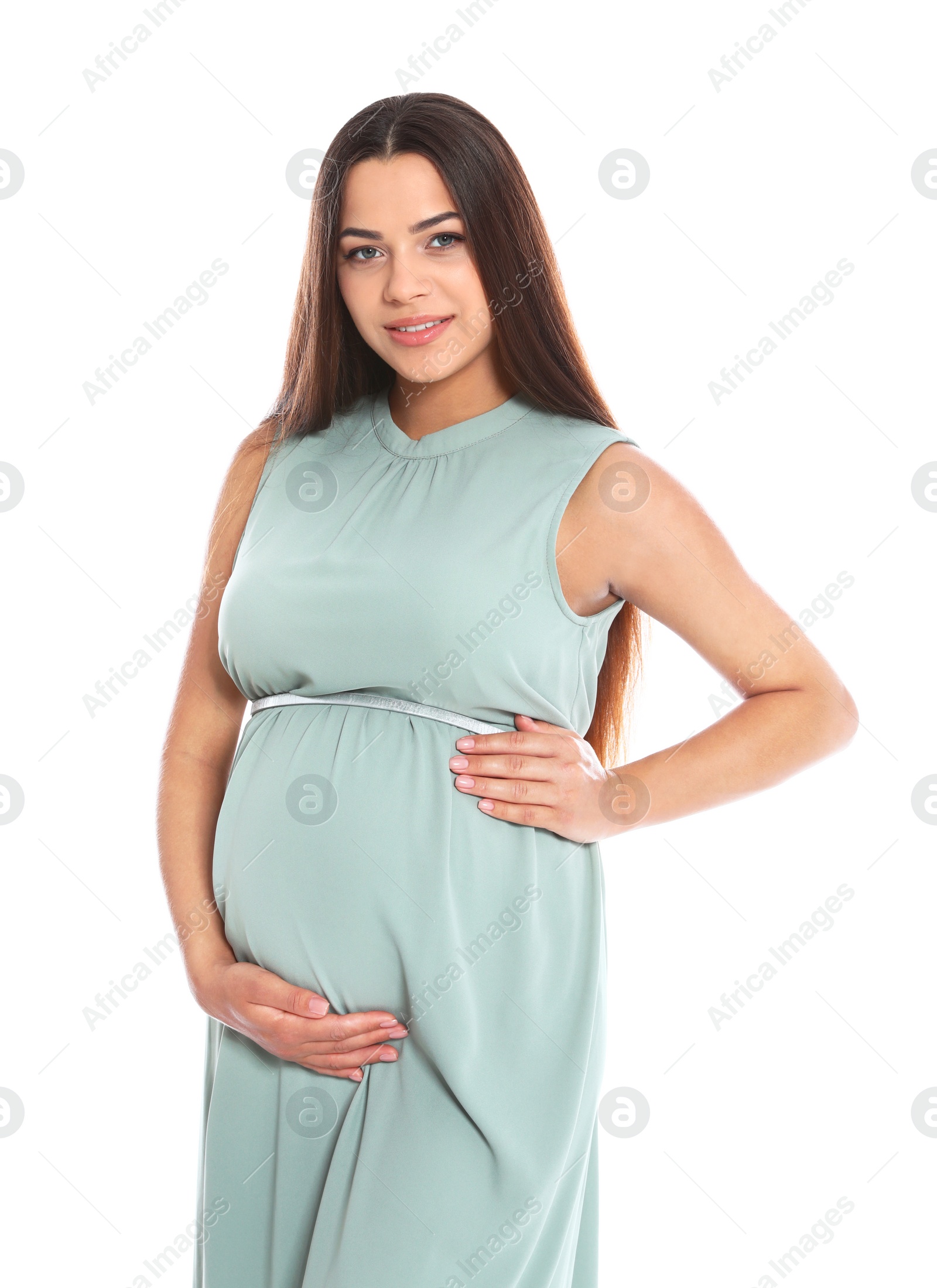 Photo of Portrait of beautiful young pregnant woman in dress on white background