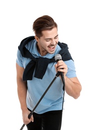 Young handsome man in casual clothes singing with microphone on white background