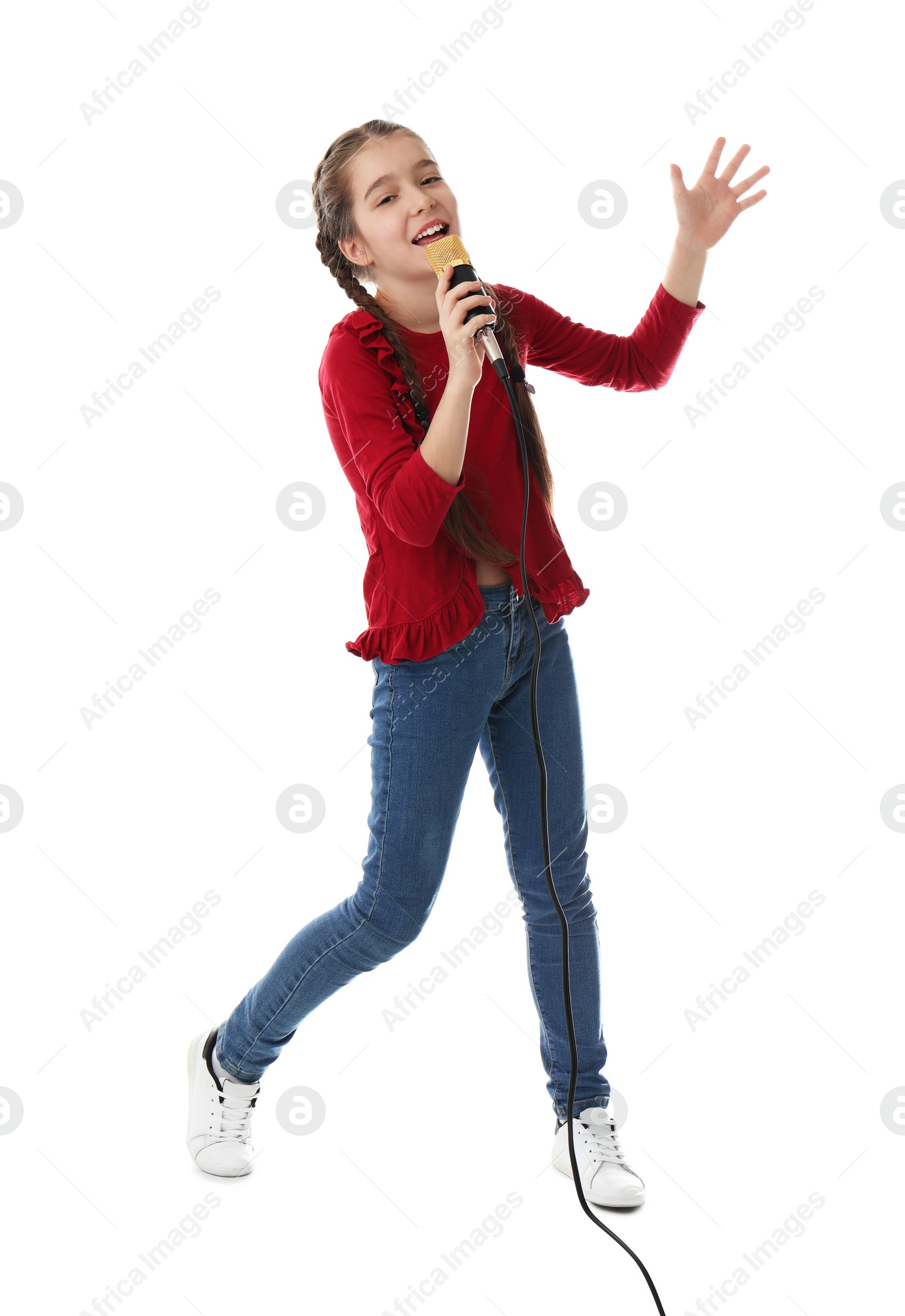 Photo of Cute girl singing in microphone on white background