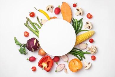 Flat lay composition with fresh vegetables and blank card for text on white background