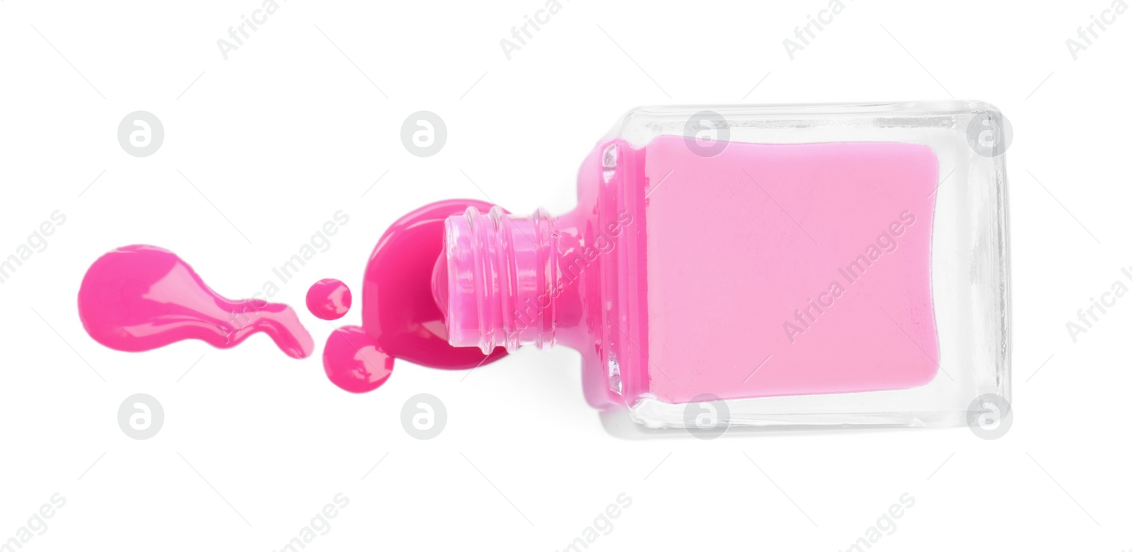 Photo of Bottle and spilled pink nail polish isolated on white, top view