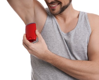 Photo of Man applying deodorant isolated on white, closeup