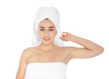 Portrait of young pretty woman with towels on white background