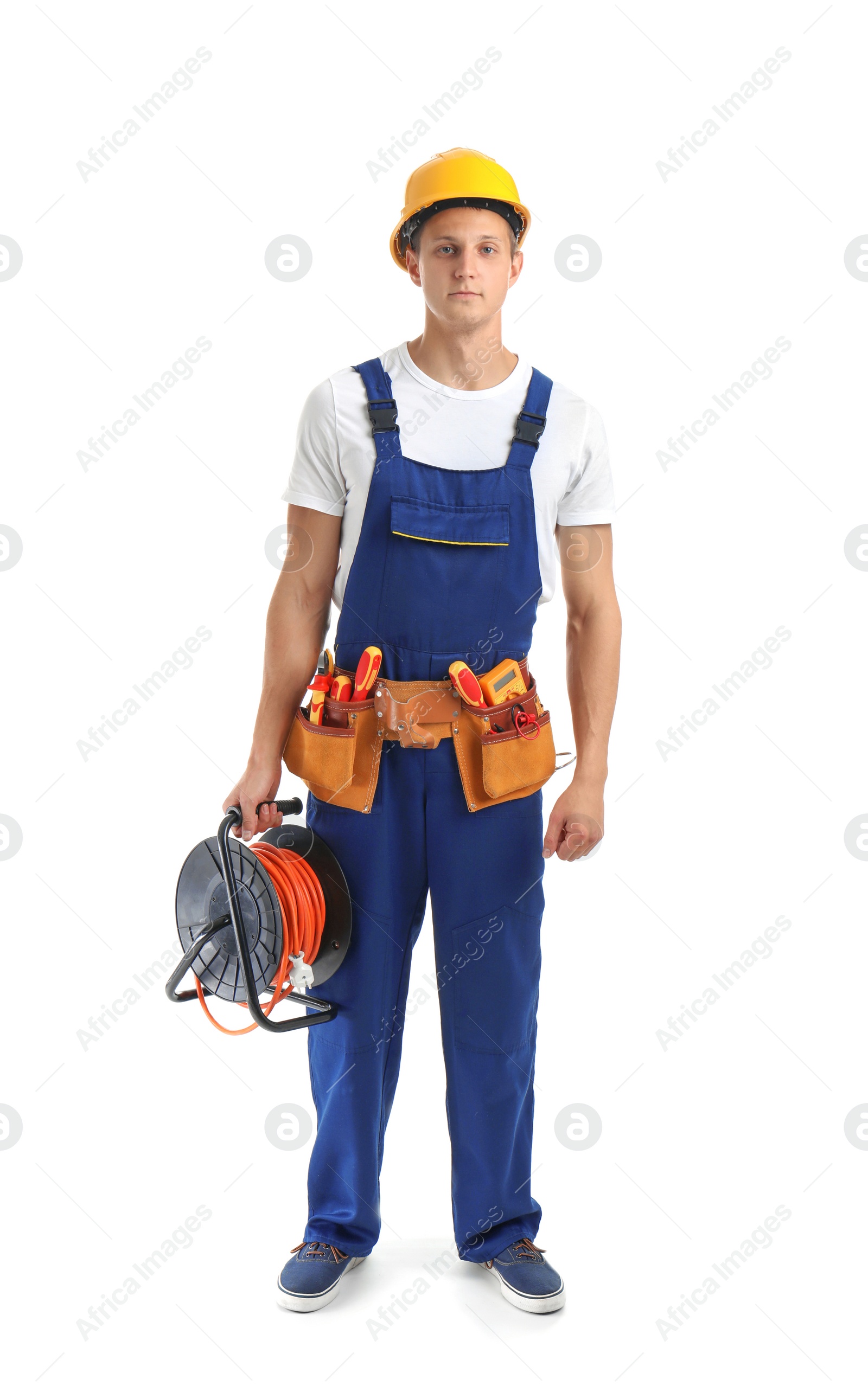 Photo of Electrician with extension cord reel and tools  wearing uniform on white background