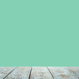 Empty wooden surface on mint background. Mockup for design