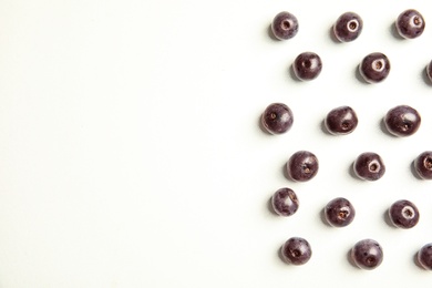 Photo of Fresh acai berries on white background