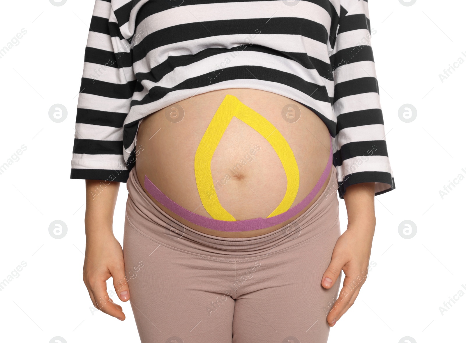 Photo of Pregnant woman with kinesio tapes on her belly against white background, closeup