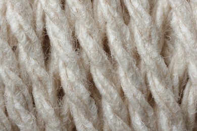 Photo of Macro photo of white woolen yarn as background, top view