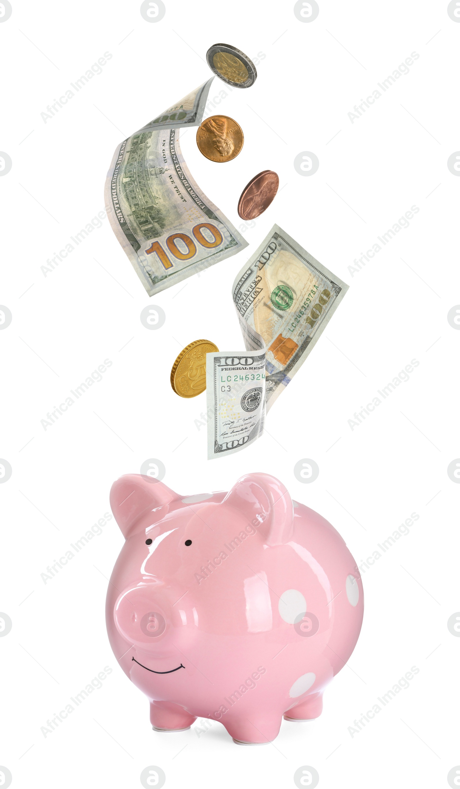 Image of Banknotes and coins falling into piggy bank on white background. Saving money