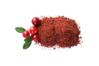 Photo of Dried cranberry powder, fresh berries and green leaves isolated on white, top view
