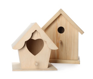 Photo of Two different bird houses on white background