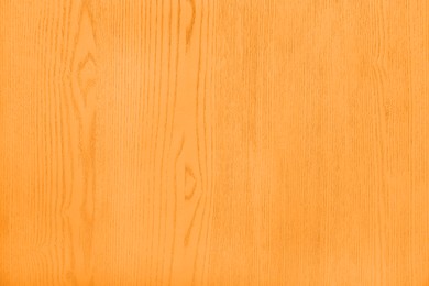 Texture of orange wooden surface as background, closeup