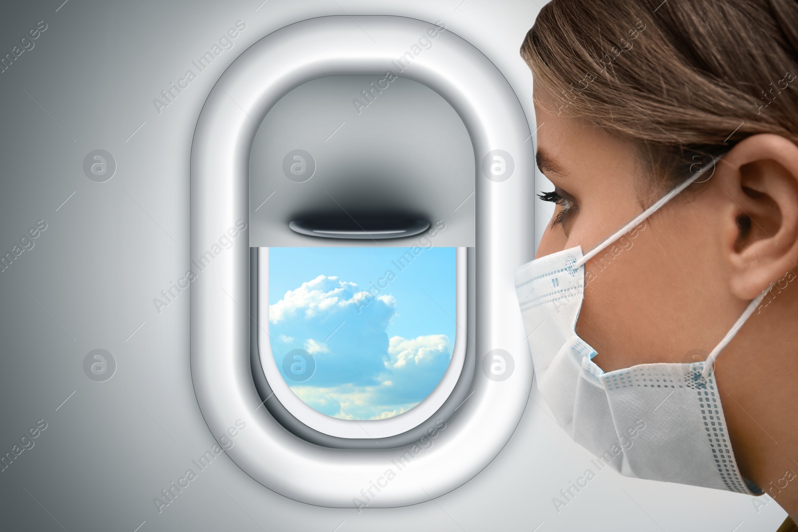 Image of Traveling by airplane during coronavirus pandemic. Woman with face mask near porthole