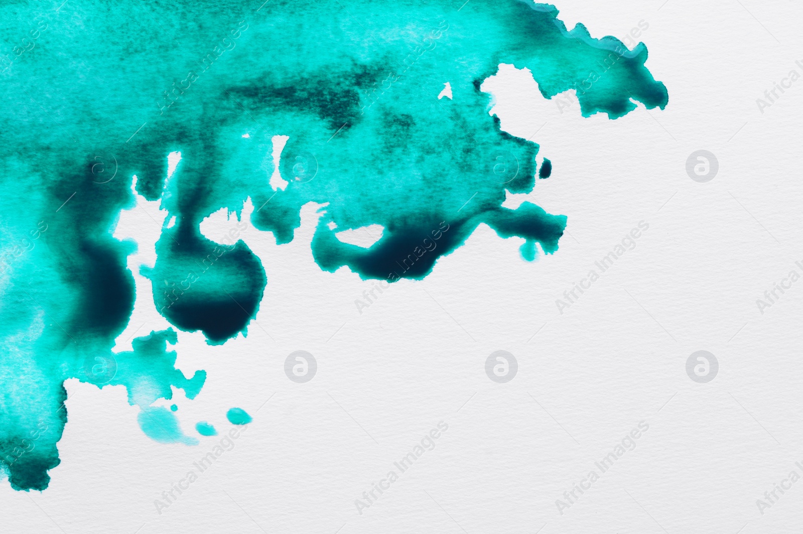 Photo of Blot of turquoise ink on white background, top view. Space for text