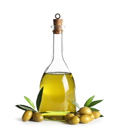 Glass bottle with fresh olive oil on white background