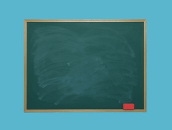 Photo of Dirty green chalkboard with duster on light blue background