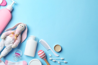Flat lay composition with baby accessories and toys on color background. Space for text