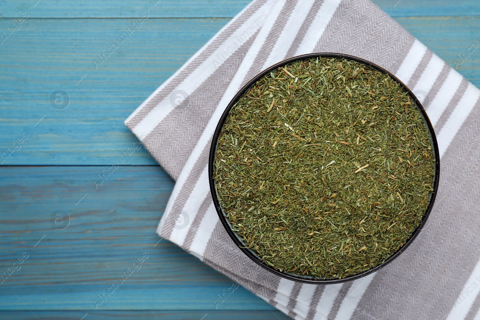 Photo of Dried dill on turquoise wooden table, top view. Space for text