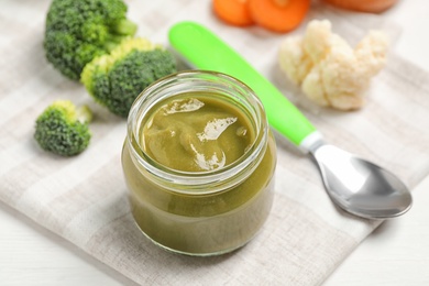 Photo of Healthy baby food and fresh ingredients on white table