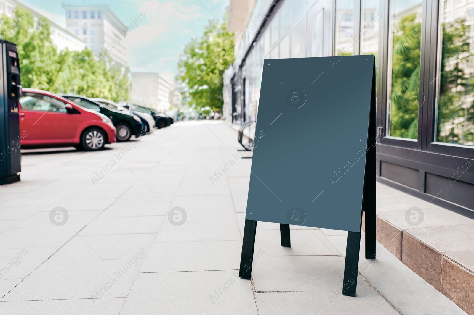 Photo of Blank advertising board on city street. Space for design