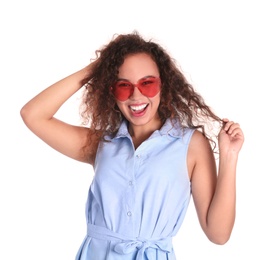 Young beautiful African-American woman wearing heart shaped glasses on white background