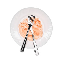 Dirty plate and cutlery on white background, top view