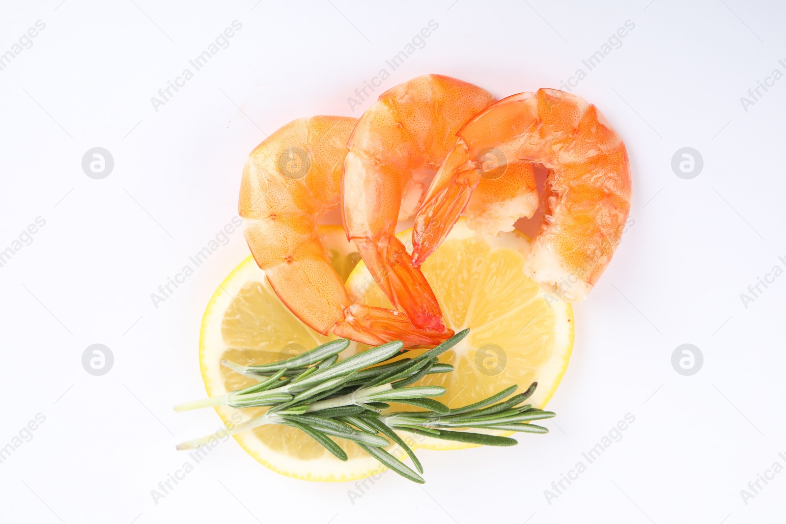 Photo of Delicious cooked shrimps, lemon and rosemary isolated on white, top view