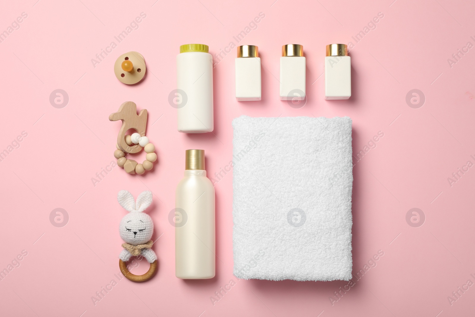 Photo of Flat lay composition with baby cosmetic products on pink background