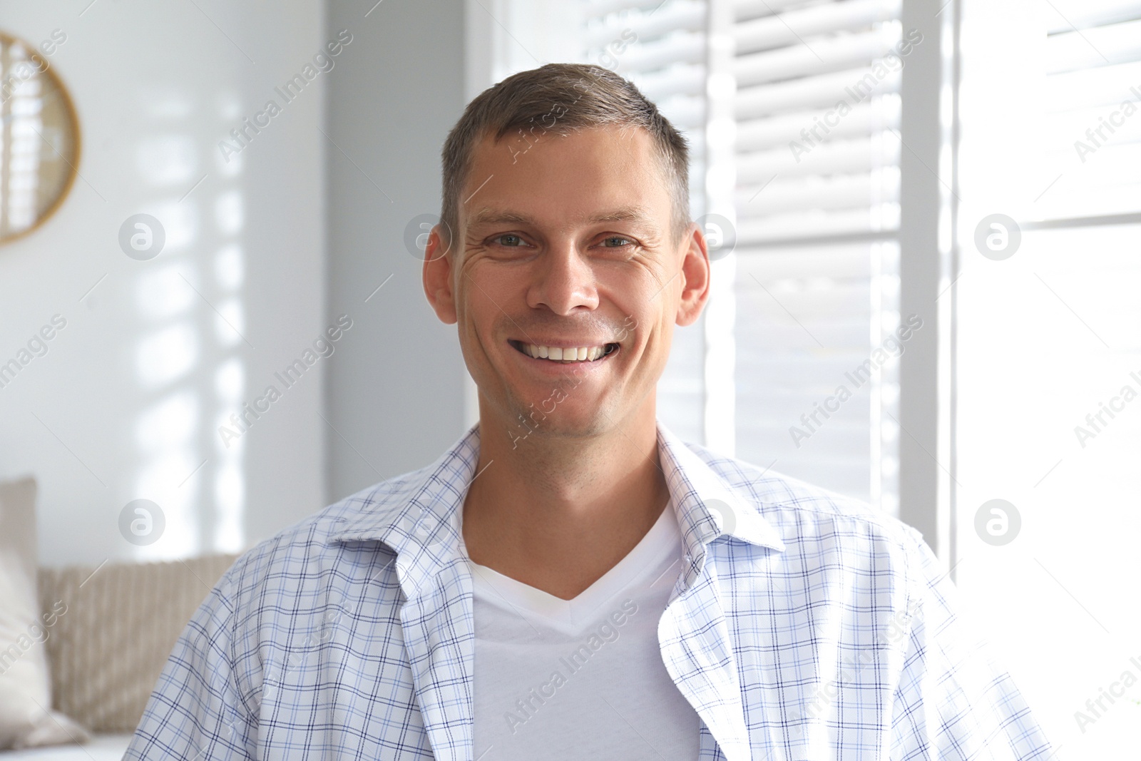 Photo of Man talking to his coworkers through video conference indoors, view from webcam