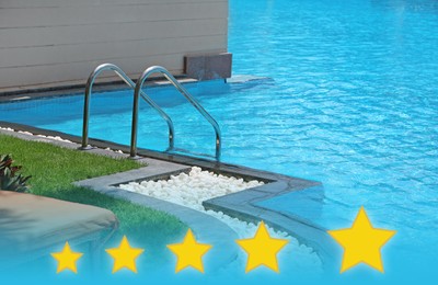 Image of Modern swimming pool with stairs at five star hotel 